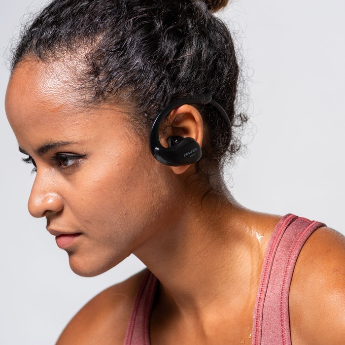 An athlete focused with wireless headphones before training